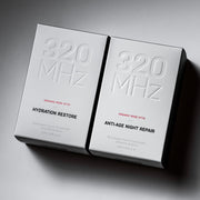Two boxes of '320 MHz' skincare products on a gray background