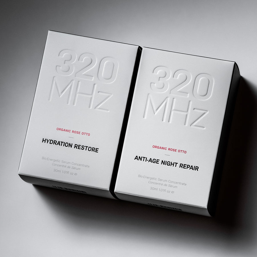Two boxes of '320 MHz' skincare products on a gray background
