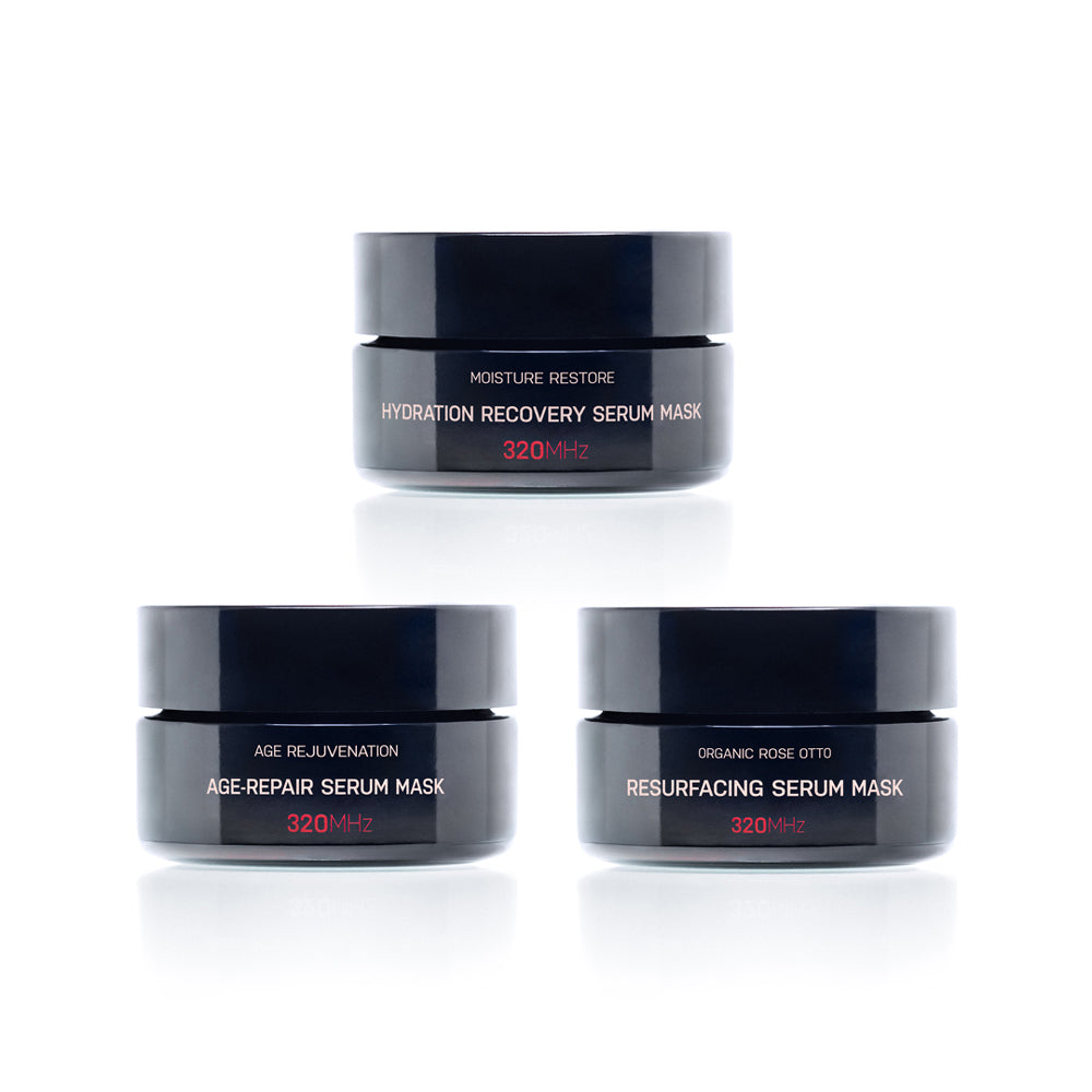 Three serum mask jars with labels on a white background