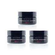 Three serum mask jars with labels on a white background
