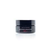 A jar of 'Age Repair Serum Mask' with a black and white label, indicating 20+ active ingredients and suitable for all skin types.