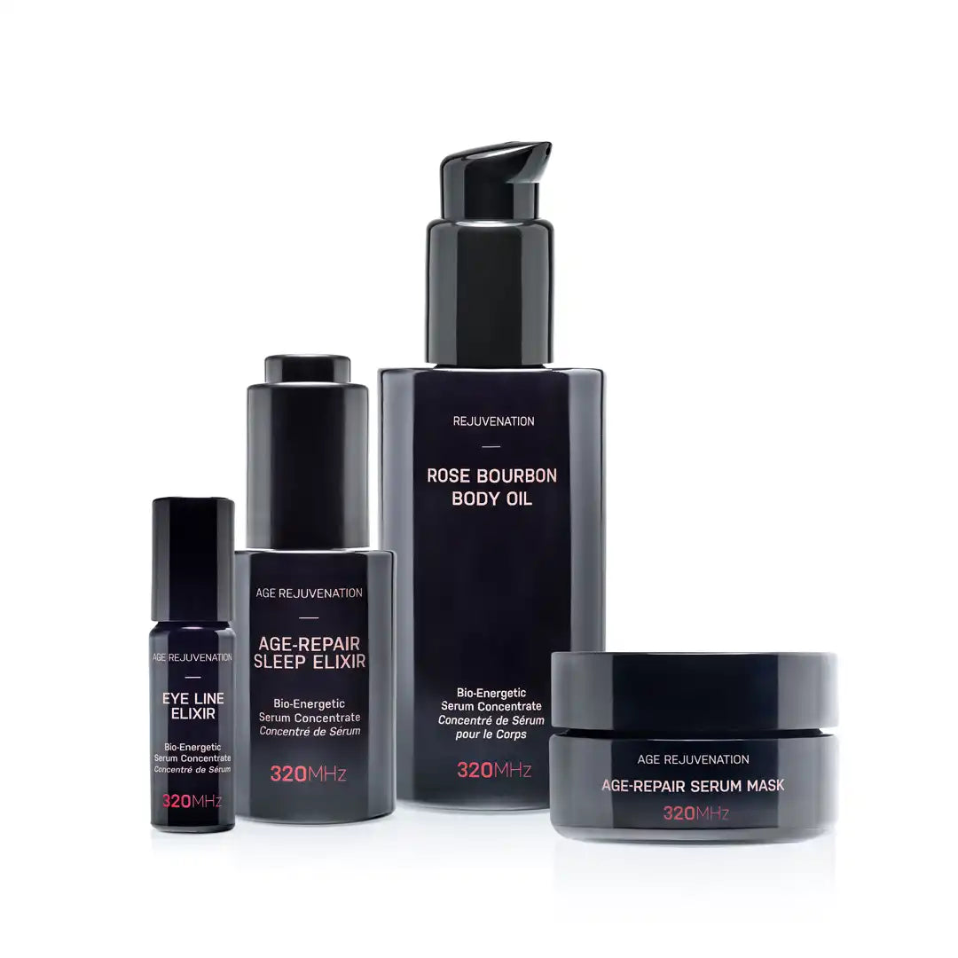 Set of skincare products including a body oil, eye line elixir, sleep elixir, and serum mask on a white background.