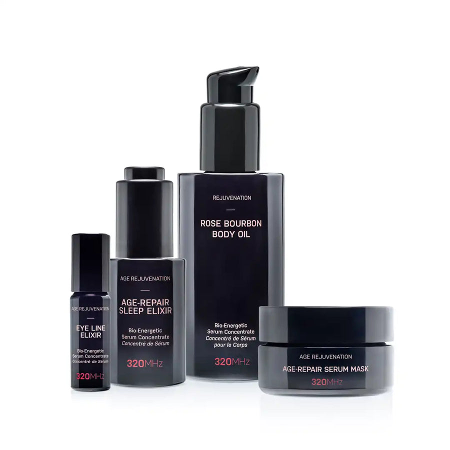 Set of skincare products including a body oil, eye line elixir, sleep elixir, and serum mask on a white background.