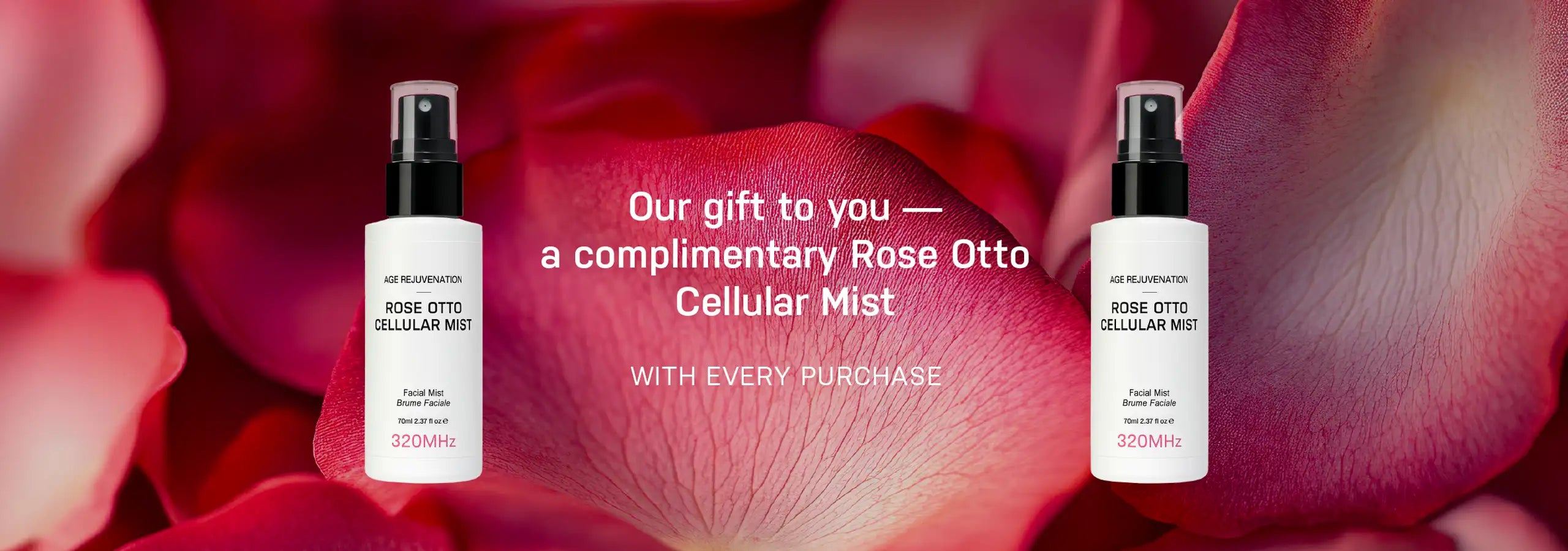 Two bottles of Rose Otto Cellular Mist with rose petals in the background